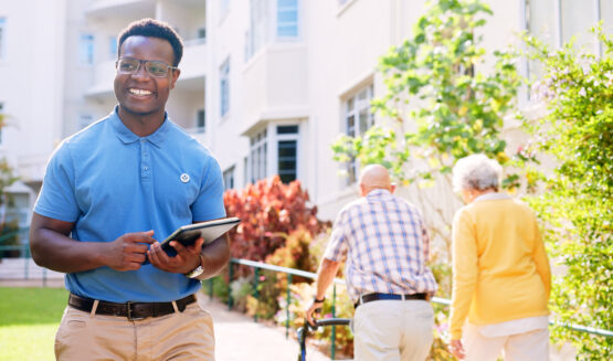 senior care nurse and tablet with man outdoors at senior community